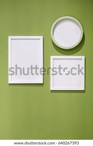 square frame and clock on green wall,interior decorate