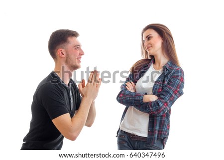 charming young guy stands idly by before girl