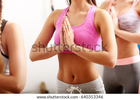 Portrait of female group practising yoga