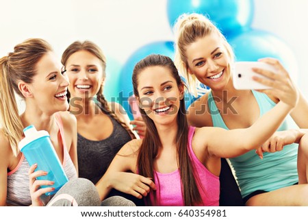 Young women group taking selfie at the gym after workout