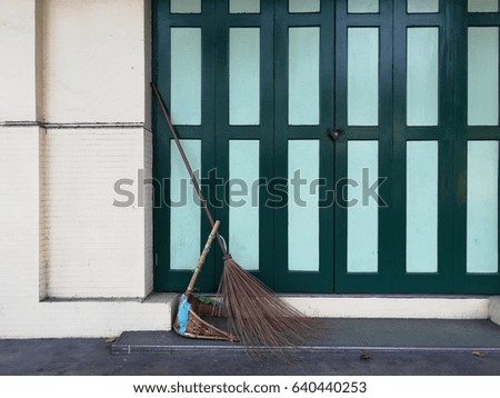 Broomstick and vintage door