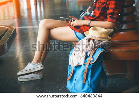 beautiful young asian girl traveling alone at train station