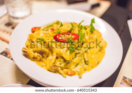 Thai yellow curry with shrimps. Thai food concept.