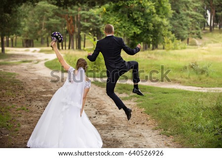 Happy wedding couple, joyful bride and groom Royalty-Free Stock Photo #640526926