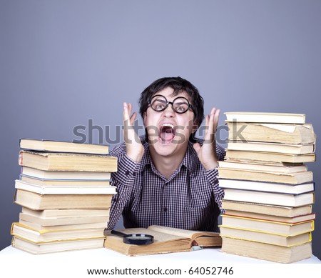 The young student with the books isolated. Studio shot.