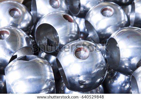 Metallic bearing balls for valves. Industrial background from part of valves for power, oil or gas industry