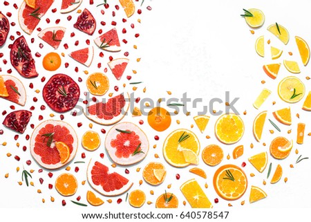 Fruit design background with cutting of citrus. Fruit pattern, top view