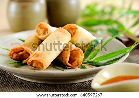 Fried chinese spring rolls with sweet chili sauce. Royalty-Free Stock Photo #640597267