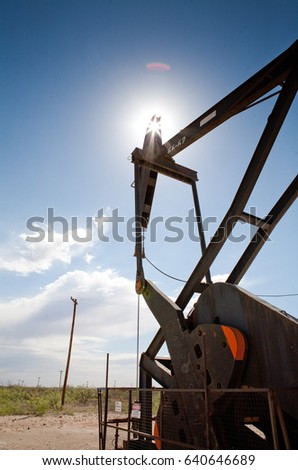 Oil well and sun. 