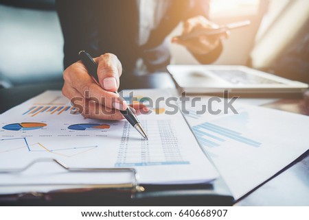 Business concept. Business people discussing the charts and graphs showing the results of their successful teamwork. Royalty-Free Stock Photo #640668907