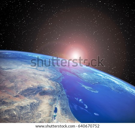 Earth and sun rays. Sunrise. "The elements of this image furnished by NASA"
