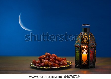 The Muslim feast of the holy month of Ramadan Kareem. Beautiful background with a shining lantern Fanus. Free space for your text Royalty-Free Stock Photo #640767391