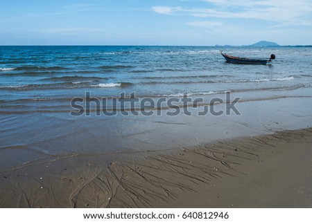 Small fishing boat on the beach.