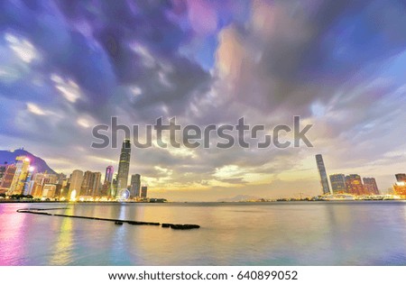 Victoria Harbor and Hong Kong skyline at twilight.
