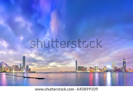 Victoria Harbor and Hong Kong skyline at twilight.