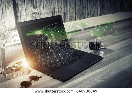 Double exposure of worldwide business working on a laptop computer and network connection technology.