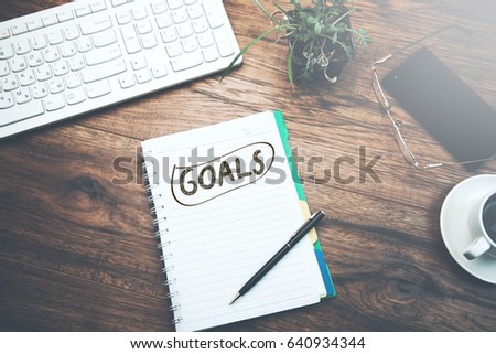 Goals concept with keyboard on wooden table