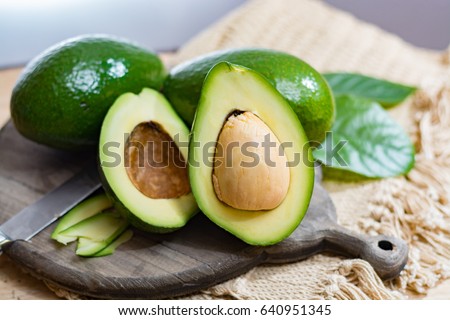 Green ripe avocado from organic avocado plantation Royalty-Free Stock Photo #640951345