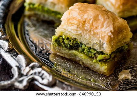 Turkish Dessert Baklava with pistachio on silver tray.
 Royalty-Free Stock Photo #640990150