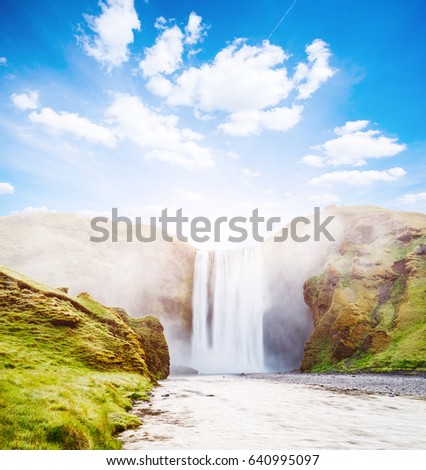 Famous Skogafoss waterfall in sunlight. Dramatic and gorgeous scene. Popular tourist attraction. Location Skoga river, highlands of Iceland, Europe. Unique place on earth. Explore the world's beauty.