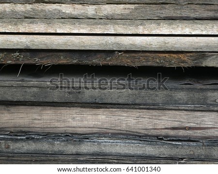 Old wood used for building structures in construction.
