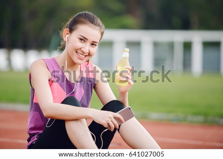 Young Asia woman runner relaxing after workout