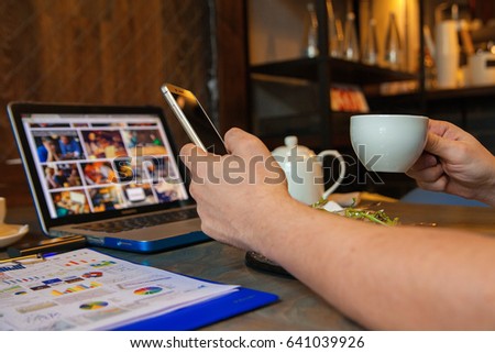 Young businessman eating dish, lunch meal at restaurant cafe
