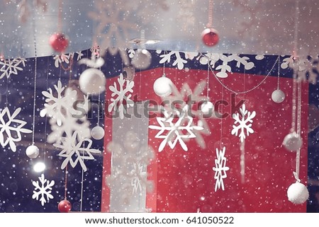 blurred Christmas lights background with snowflakes new year