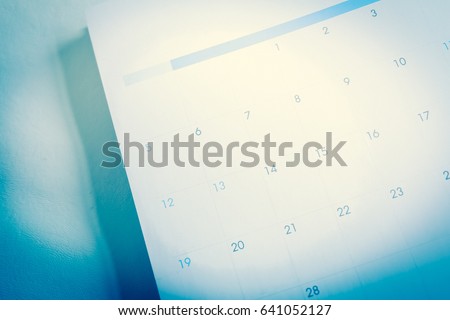 Blurred calendar with pencil in blue tone Royalty-Free Stock Photo #641052127