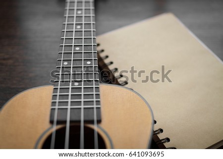 Hawaiian guitar - Ukulele with empty notepad