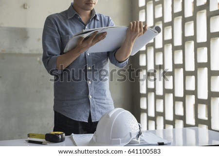Architects are checking blueprints for approval.Engineers are checking blueprints for approval.Professional work Before blueprint approval For construction business.