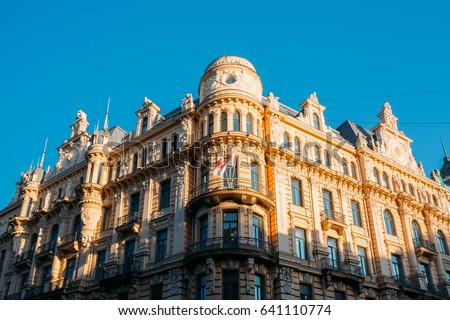 Riga, Latvia. Facade Of Old Art Nouveau Building Designed By Mikhail Eisenstein On 13 Alberta Street, Currently Houses The Graduate School Of Law. Sunny Summer Day Under Blue Clear Sky. Royalty-Free Stock Photo #641110774