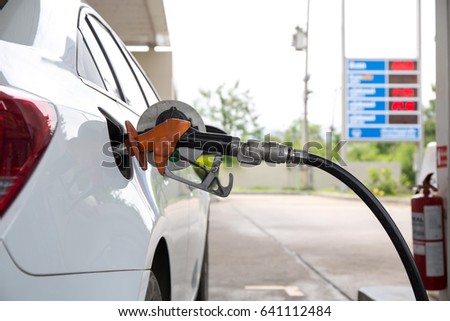 transportation and ownership concept - man pumping gasoline fuel in car at gas station
 Royalty-Free Stock Photo #641112484