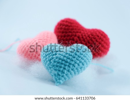 three heart crochet  on a white background