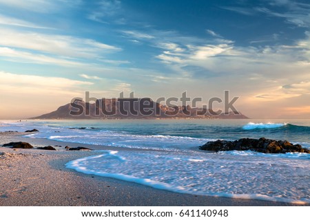 Table mountain in cape town south africa scenic view from bloubergstrand at sunset Royalty-Free Stock Photo #641140948