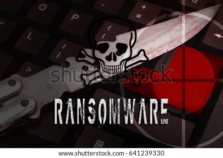 a sniper target on  knife and computer keyboard with human skull logo in red colour tone effect