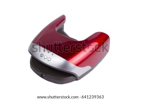 Red manicure gel curing lamp isolated on white