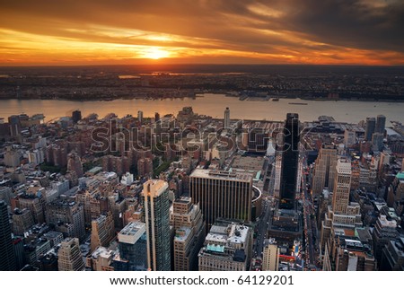 New York City Manhattan sunset skyline aerial view with office building skyscrapers and Hudson River.