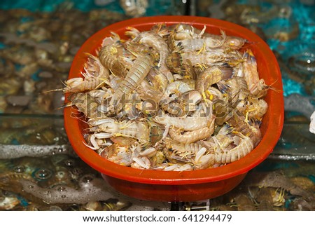 Fresh shrimp sea foods sale during a weekend wet market. Seafood market. Fishmarket, China.