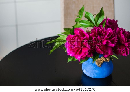 Purple peony flowers as a summer floral concept