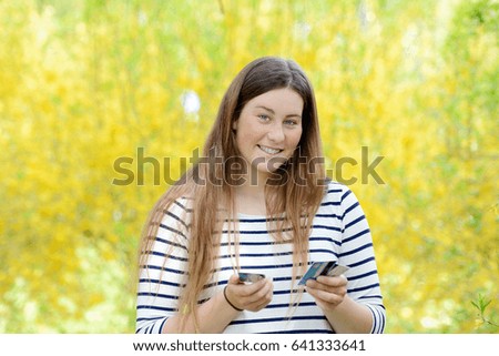 Business woman holding credit cards.