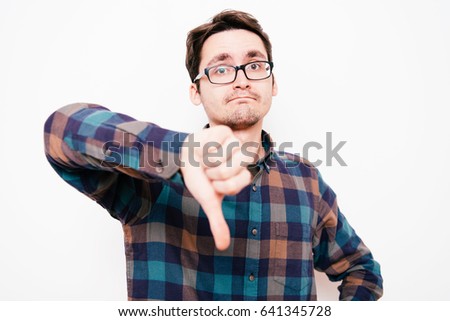 man showing a thumb down gesture