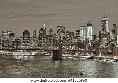HDR view of Lower Manhattan with Brooklyn Bridge at night.