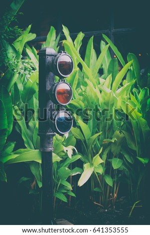 Vintage traffic lights in the forest garden , Dark green tones,Classic vintage style