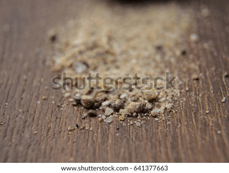 Sand grains on wood board,macro