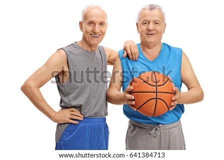 Two elderly men in sportswear with a basketball isolated on white background 