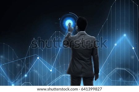 business, statistics, people and technology concept - businessman working with virtual chart projection from back over black background