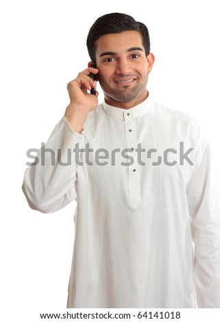 Smiling ethnic business man using phone - in traditional ethnic robe - Kurta - fastened with ruby buttons. The name Kurta is from Urdu & Hindi, & originally Persian (literally, "a collarless shirt"). Royalty-Free Stock Photo #64141018