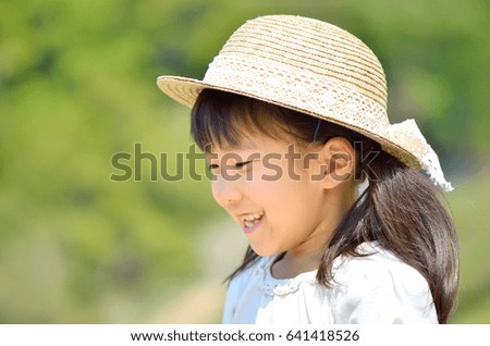 Girls smiling  (straw hat)