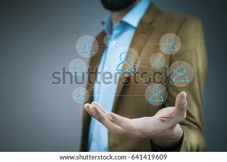 business man hand holding network on screen 